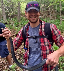 Andrew captures a skittish Coluber constrictor during Field Herpetology 2015