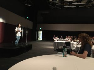 Asher tells their story to a roomful of evolutionary biologists at StoryCollider during the Evolution conference